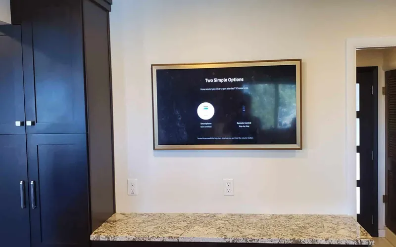Television mounted in a finished room with built-in cabinetry