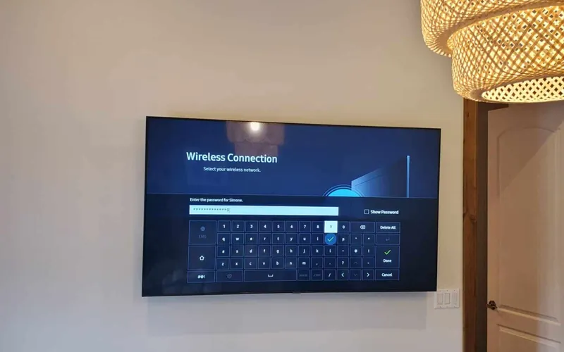 Mounted television with a clean wall and equipment positioned below